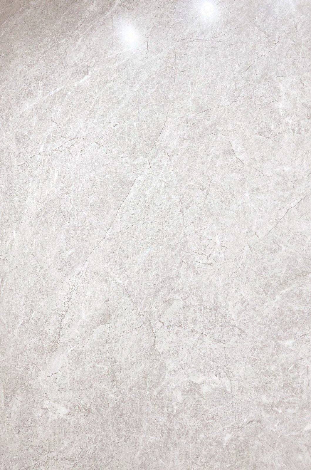 Losa de piedra sinterizada gris del muestrario de materiales para mobiliario a medida.